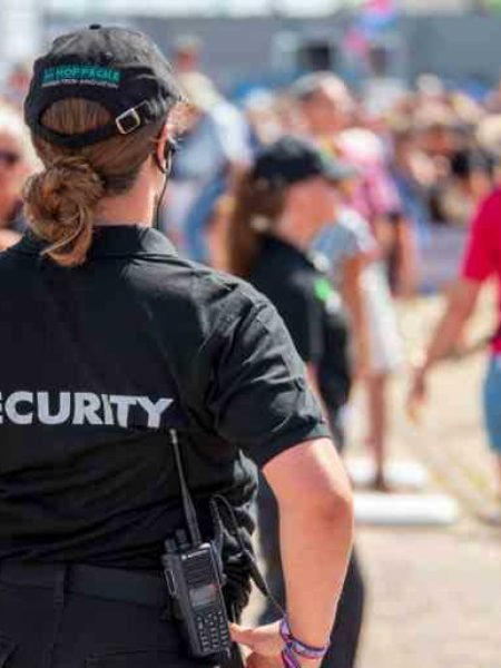 a-woman-in-a-security-uniform-at-an-event